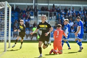 Thelo Aasgaard wheels away in delight after scoring Latics' third goal at Bristol Rovers