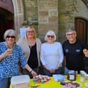 Coun Chris Ready, right, meets volunteers at the Church Yard Cafe at St David's Church, Haigh