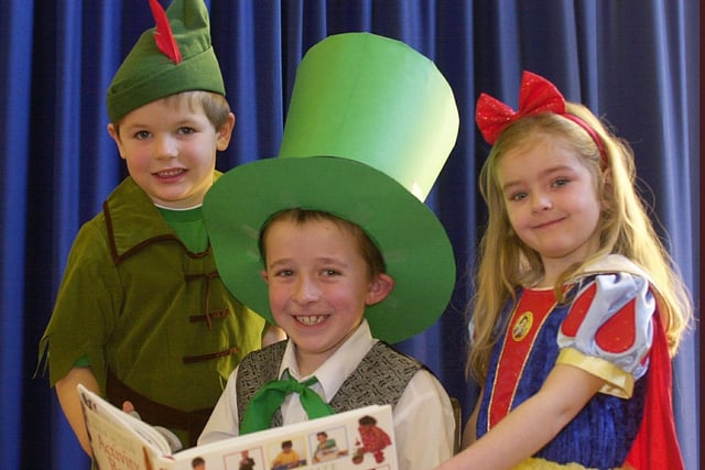 2005 - Peter Pan and Snow White were joined by the Mad Hatter at St Oswald's RC Primary school, Ashton-in-Makerfield, in celebration of World Book Day.  from left, Connor, Andrew and Grace.