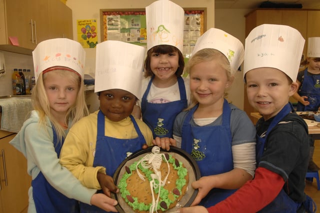 Youngsters at Ince Children's Centre, Pickup Street, Ince, took part in half-term cookery sessions making Hallowe'en Cakes. Pictured are (left to right): Lucy, Tawana, Megan, Kacey and Ryan