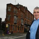 Tony Callaghan, pictured outside a derelict building on King Street West, Wigan, he is hoping to redevelop