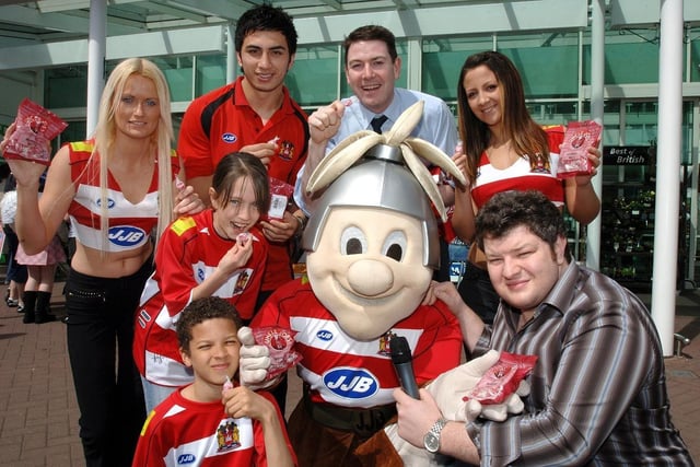 Wigan Warriors players celebrate Wigan's Best at ASDA campaign.