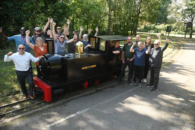 Celebrations as plans to restore Haigh Woodland Railway are back on track, thanks to Wigan Council investment.  Pictured are dedicated volunteers who form the Haigh Woodland Supporter's Association (HWRSA) with members of Wigan Council and ward councillors at Haigh Woodland Park.