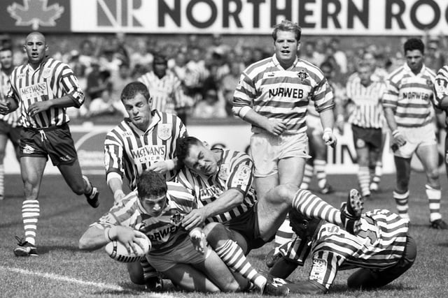 Wigan stand-off Nigel Wright touches down for a try against St. Helens in a league match at Knowsley Road on Monday 28th of August 1995.
Wigan won 52-20.