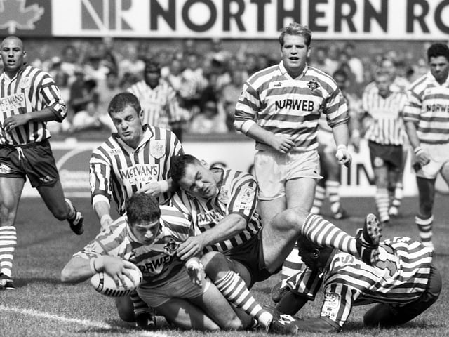 Wigan stand-off Nigel Wright touches down for a try against St. Helens in a league match at Knowsley Road on Monday 28th of August 1995.
Wigan won 52-20.