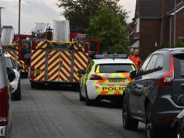 Firefighters remain at the scene of the fatal fire in Newstead Road, Goose Green