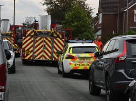 Firefighters remain at the scene of the fatal fire in Newstead Road, Goose Green