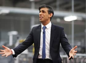 Rishi Sunak talks to local business leaders during a visit to a Coca-Cola factory in Lisburn, Northern Ireland yesterday (Picture: Liam McBurney/WPA pool/Getty Images)