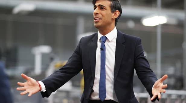 Rishi Sunak talks to local business leaders during a visit to a Coca-Cola factory in Lisburn, Northern Ireland yesterday (Picture: Liam McBurney/WPA pool/Getty Images)