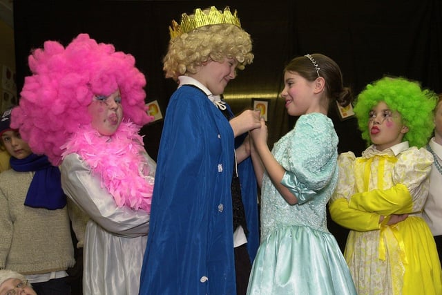 Prince Charming gets his girl much to the annoyance of The Ugly Sisters during Newtown St Mark's CE Primary School Christmas show 'Who, What, Why, When?' in which two aliens, Dr What and Dr When, come down to earth to see what Christmas is all about.