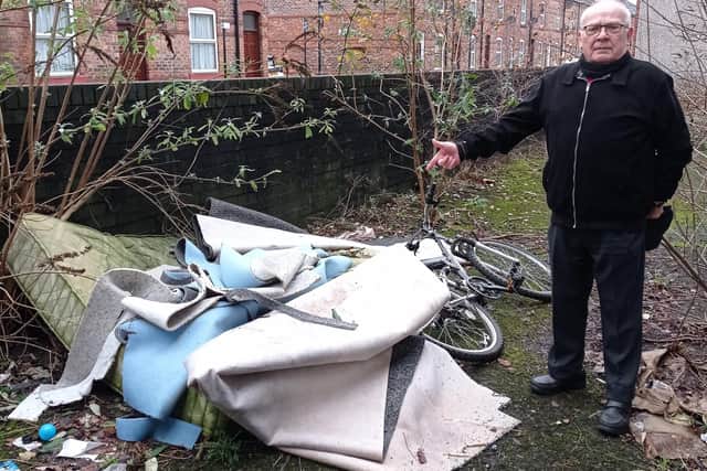 Coun George Davies campaigned against fly-tipping on Spring Gardens in Wigan