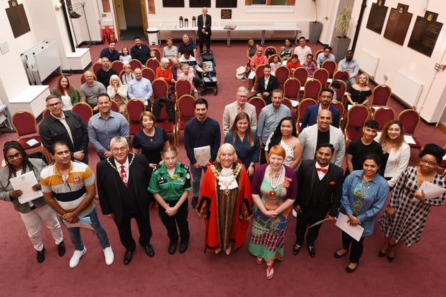 The Mayor of Wigan Coun Marie Morgan with the new British citizens and their family and friends at the event held at Wigan Town Hall.
