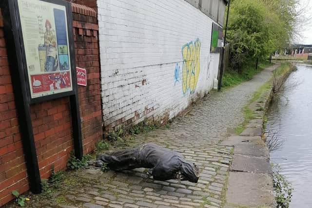 The newly vandalised statue next to the Wigan Pier tippler