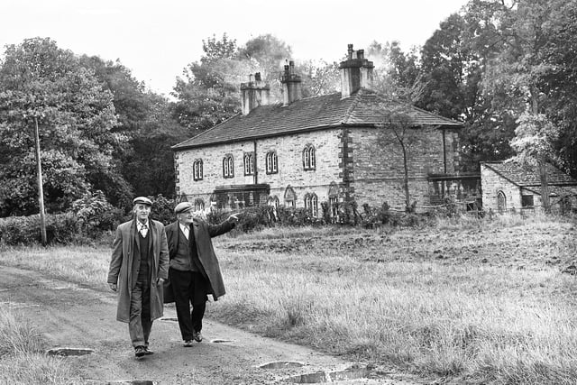 Ted Hulme and Bill Fletcher stroll past the Alms Houses just off Hall Lane and Wigan Lane in October 1974.
The houses were built in 1772 as cottages for the poor.