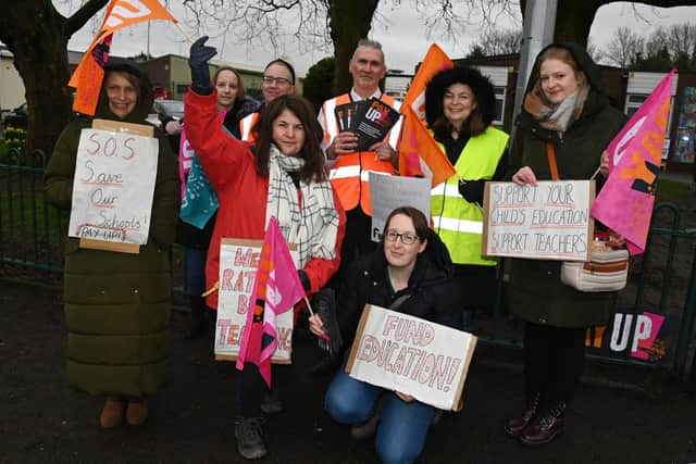 Teaching staff and supporters of the NE) on the picket line outside St Paul's CE Primary School in Goose Green