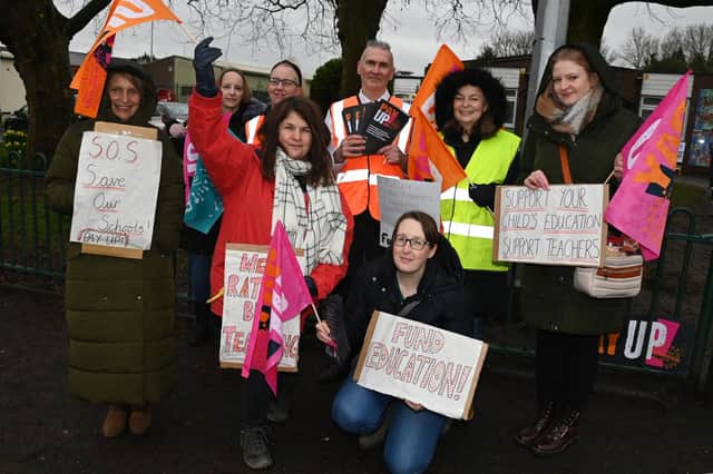 Teaching staff and supporters of the NE) on the picket line outside St Paul's CE Primary School in Goose Green