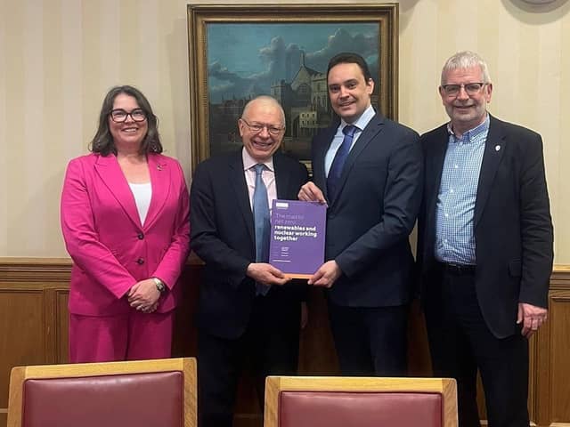 Dr William Bodel (second from right) presents Lord Hunt, Minister for Energy Security and Net Zero, with the Dalton Nuclear Institute policy paper from which his article is sourced, alongside University of Manchester colleagues Professor Zara Hodgson and Professor Adrian Bull