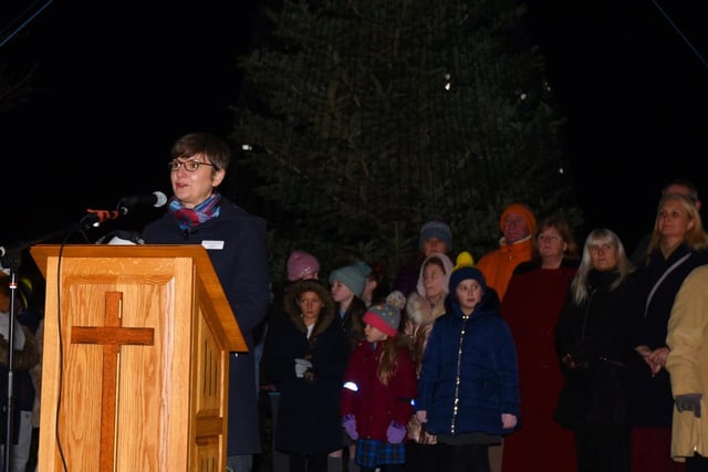 Hospice chief executive officer Jo Carby speaks during the service