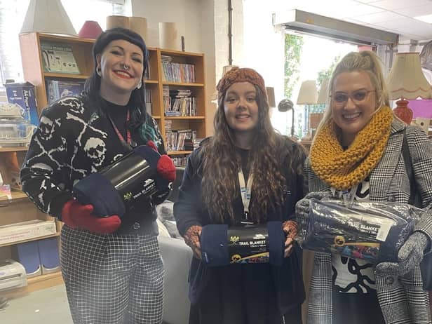Staff from M&Y Maintenance and Construction with donations for The Brick