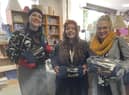 Staff from M&Y Maintenance and Construction with donations for The Brick