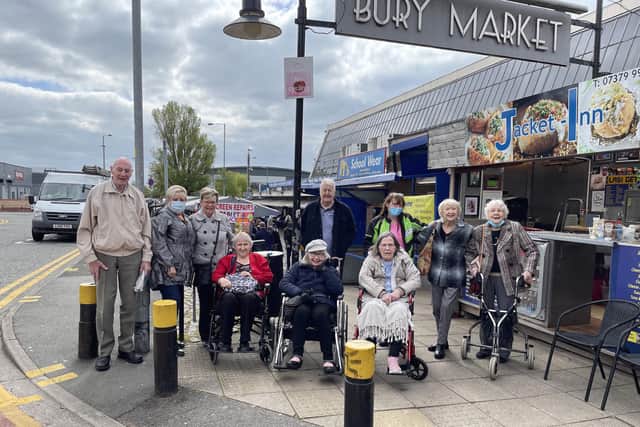 Belong Wigan care village residents at Bury Market
