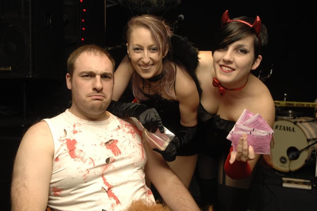 Russ Starkie prepares to be waxed by his wife Gemma Starkie and family friend Jenny Spence during a Halloween fun night at The Boulevard raising money for his son Max to have autism treatment in the USA