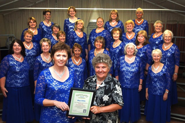 2006 - Ashton Ladies Barber Shop Choir. Mary Clarke with Mrs Jo Parker from Member Relations of United Co-Operative Community Awards.