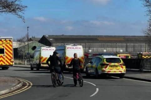 Emergency services behind the Brick Community Stadium this afternoon