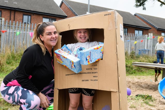 Catherine and Evie Morris (6) have fun with boxes at the Norley Hall fun day. Photo: Kelvin Stuttard