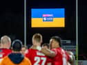 Rugby league players stand in solidarity with Ukraine