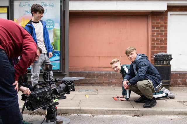 Adam Little on the set of Coronation Street with Paddy Bever as Max and Tareg Al-Jeddal as Chris