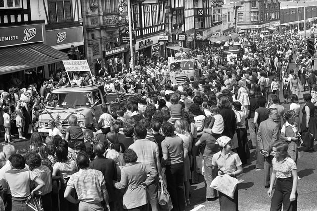 A huge crowd watches the Wigan Carnival parade make its way up Standishgate on Saturday 28th of May 1977.