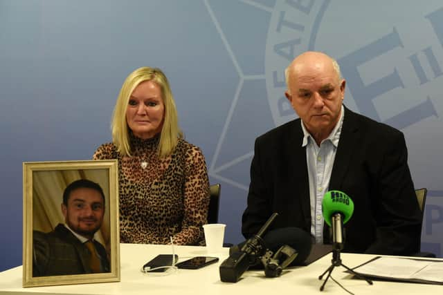 Liam Smith's parents, Julia and Phil Smith, with a photograph of their son