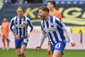 Scott Smith wheels away in delight after scoring his first senior goal against Blackpool