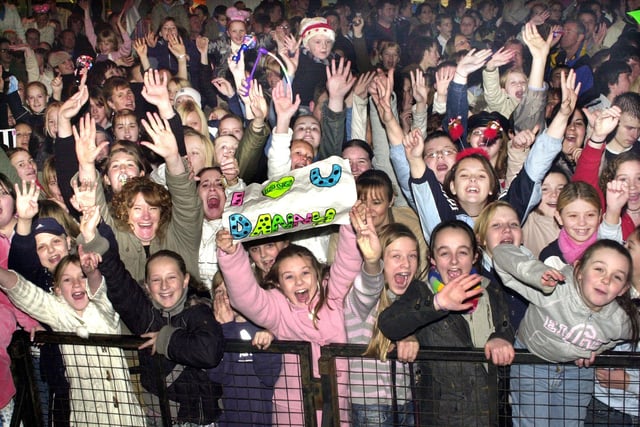 2004 - Some of the 7,000 people in Wigan Market Place to watch McFly turn on the Christmas lights and perform on stage in 2004.