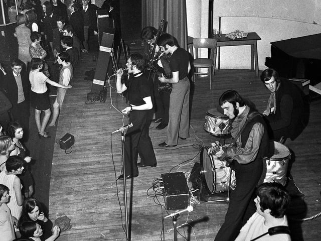 Wigan Casino on a Sunday night in the late 1960s with local group Harlem John's Reshuffle on stage.