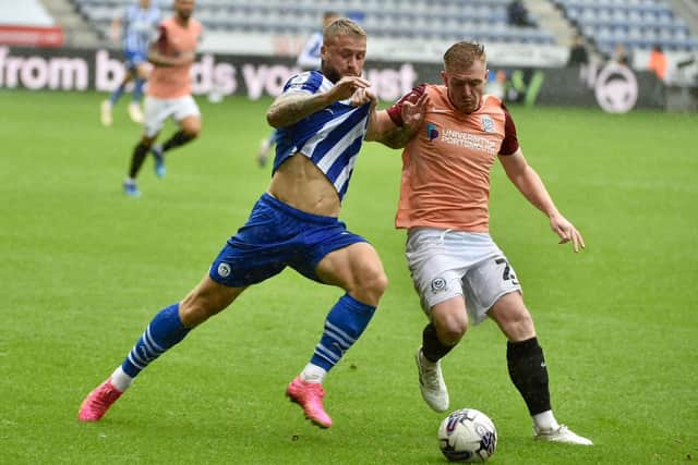 The Pompey defence keep a tight hold of Stephen Humphrys