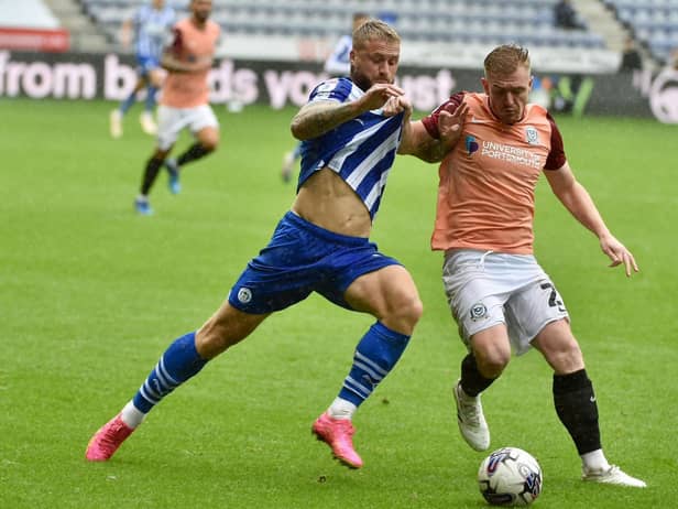 The Pompey defence keep a tight hold of Stephen Humphrys
