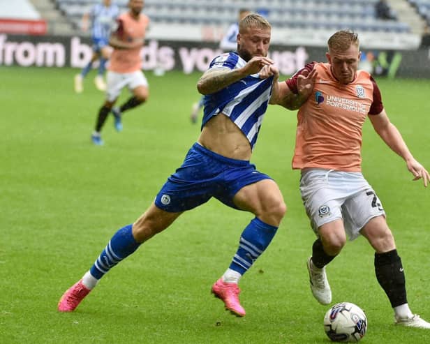 The Pompey defence keep a tight hold of Stephen Humphrys