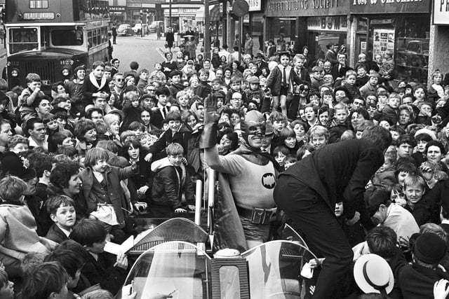 The crowds gather for the arrival of Batman and Robin to open the Green Shield Stamp shop in Crompton Street, Wigan, in 1967.