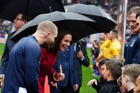 The Princess of Wales meeting the mascots.