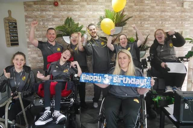 Members of Happy Smiles celebrating its third birthday