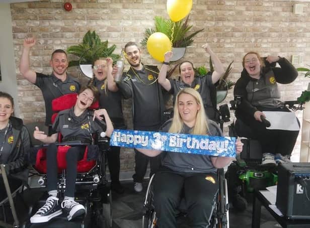 Members of Happy Smiles celebrating its third birthday