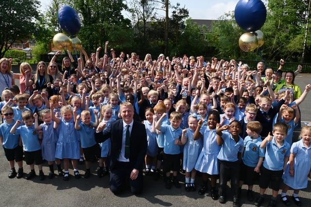 Staff and pupils celebrate the recent Ofsted report.