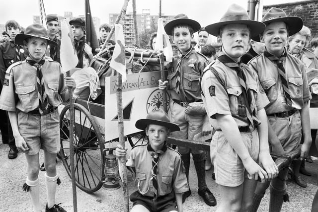 Members of the 7th Wigan All Saints Scouts dressed in the uniform from an earlier era to celebrate the 75th anniversary of the scout movement at the St. George's Day parade on Sunday 24th of April 1983.