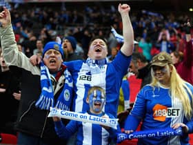 Wigan Athletic fans enjoy the atmosphere during the FA Cup with Budweiser Semi Final match between Millwall and Wigan Athletic at Wembley Stadium on April 13, 2013