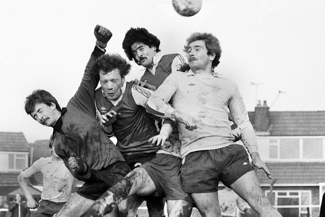 Gary Dickens takes on two defenders and the goalkeeper for the Post and Chronicle Sunday League against Oldham Sunday League in the Lancashire Inter League Tourney quarter-final at Ashton Town's ground on Sunday 21st of December 1980.
The Post League won in a competition record win 11-2.