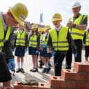 George C, aged 9, learns to lay bricks with Bellway