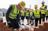 George C, aged 9, learns to lay bricks with Bellway
