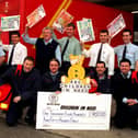 The postmen of Wigan have collected a staggering £1,450.00 for children In Need thanks to the generosity of the poeple from Wigan after collecting the money on their rounds.  Pictured with the cheque are some of the members of the team who collected the funds.